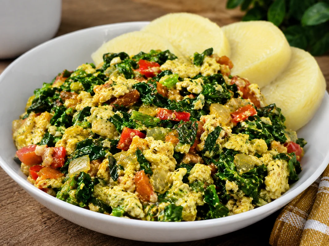 Vegetable egg sauce served with boiled yam slices
